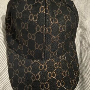 Elegant Black and Gold Patterned Hat